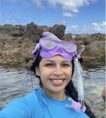 A woman wearing a purple mask decided to book a cruise with a Travel Agency. by Chasing the Sun Vacations