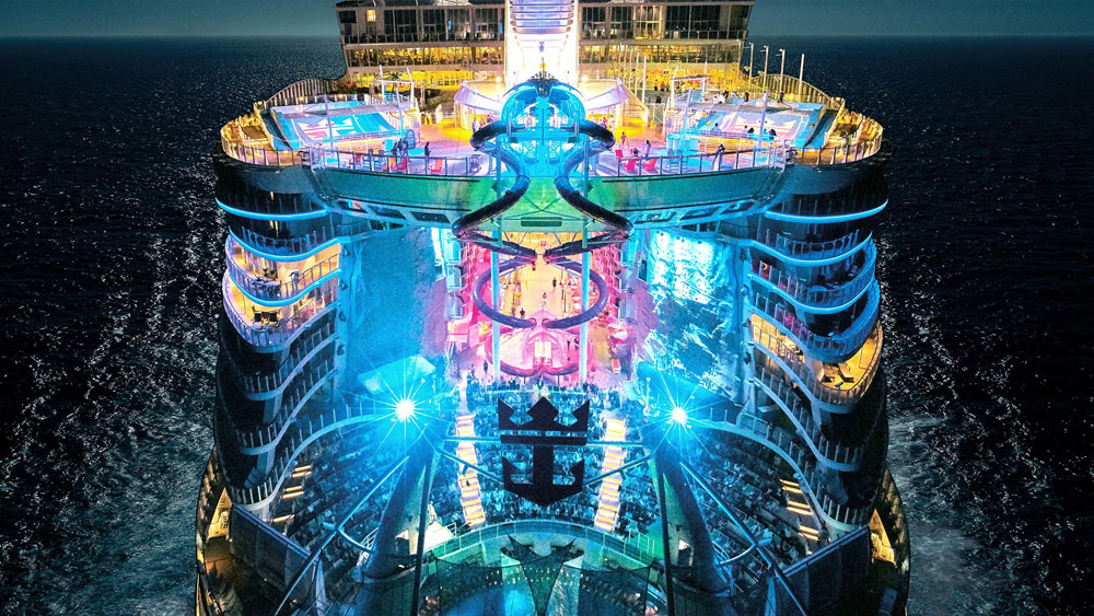 The deck of a cruise ship at night, offering an enchanting experience for travelers seeking unforgettable moments on their voyage. by Chasing the Sun Vacations