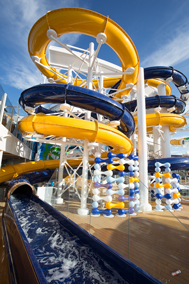 A water slide on a cruise ship offers the exhilarating experience of zooming down thrilling twists and turns while enjoying your vacation onboard. Whether you book a cruise through a Travel Agency or directly with the Cruise by Chasing the Sun Vacations